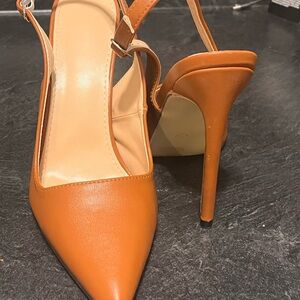 Women’s brown point toe sling back heel